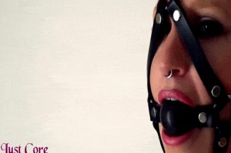 Blonde slave with harness gag