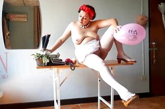Office Obsession, The naked secretary in the office wiht white apron blows balloons, masturbates.
